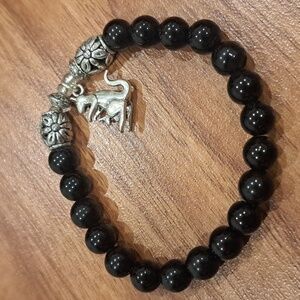 Black beaded bracelet with kangaroo charm